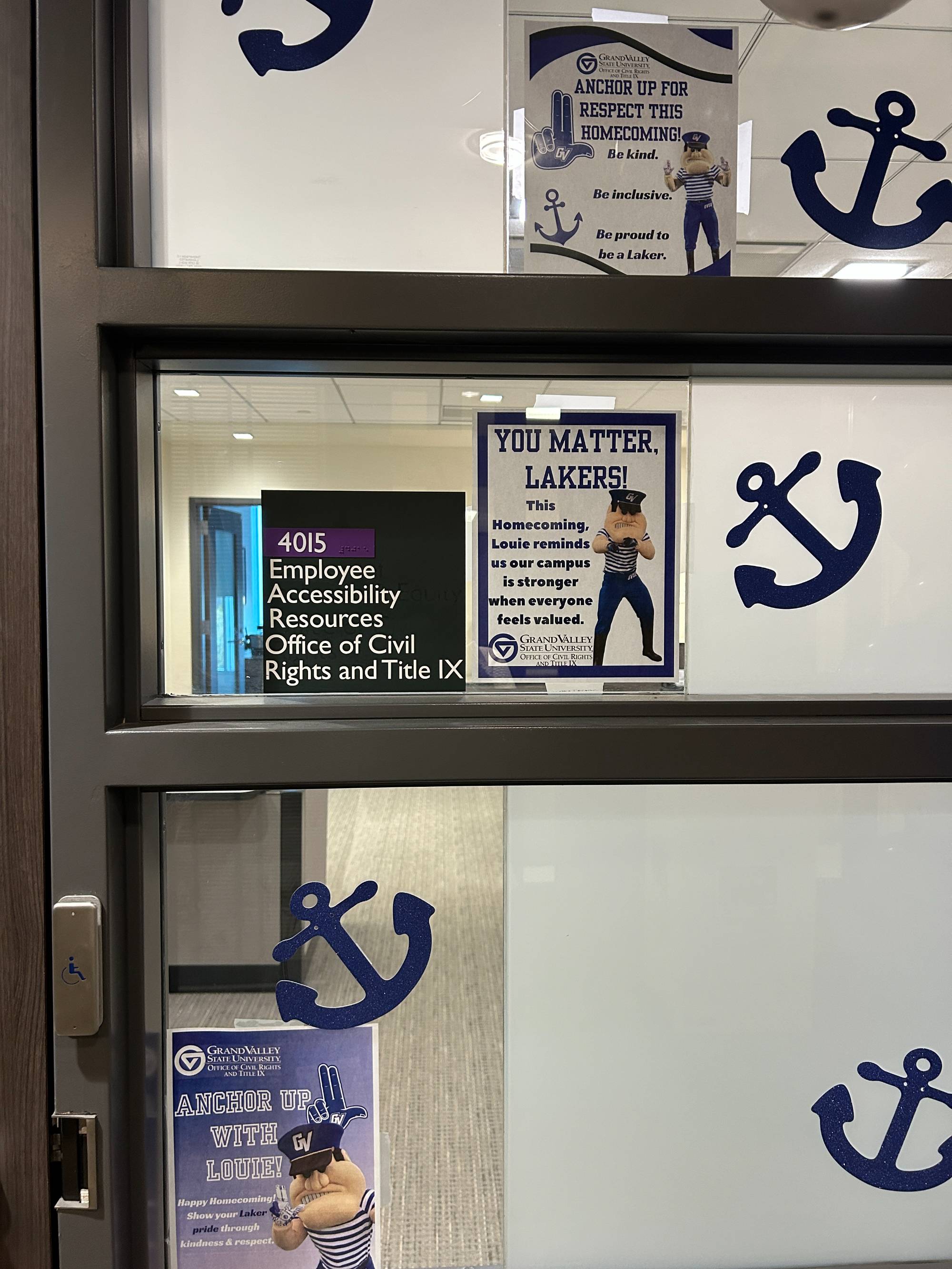 Close up of a "You Matter Lakers" sign with Louie on it